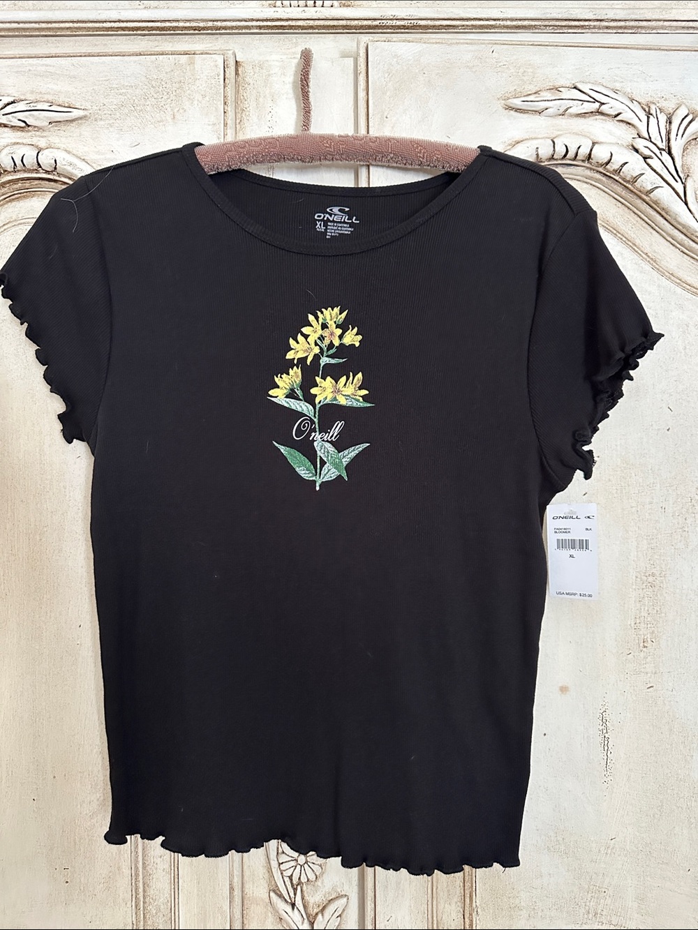 O'Neill Black Short-Sleeve Tee with Yellow Floral Graphic and sweet ruffled edge